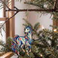 Laser-cut maple wood Arabian Horse folk art ornament O477 hanging on a fir branch, made in USA