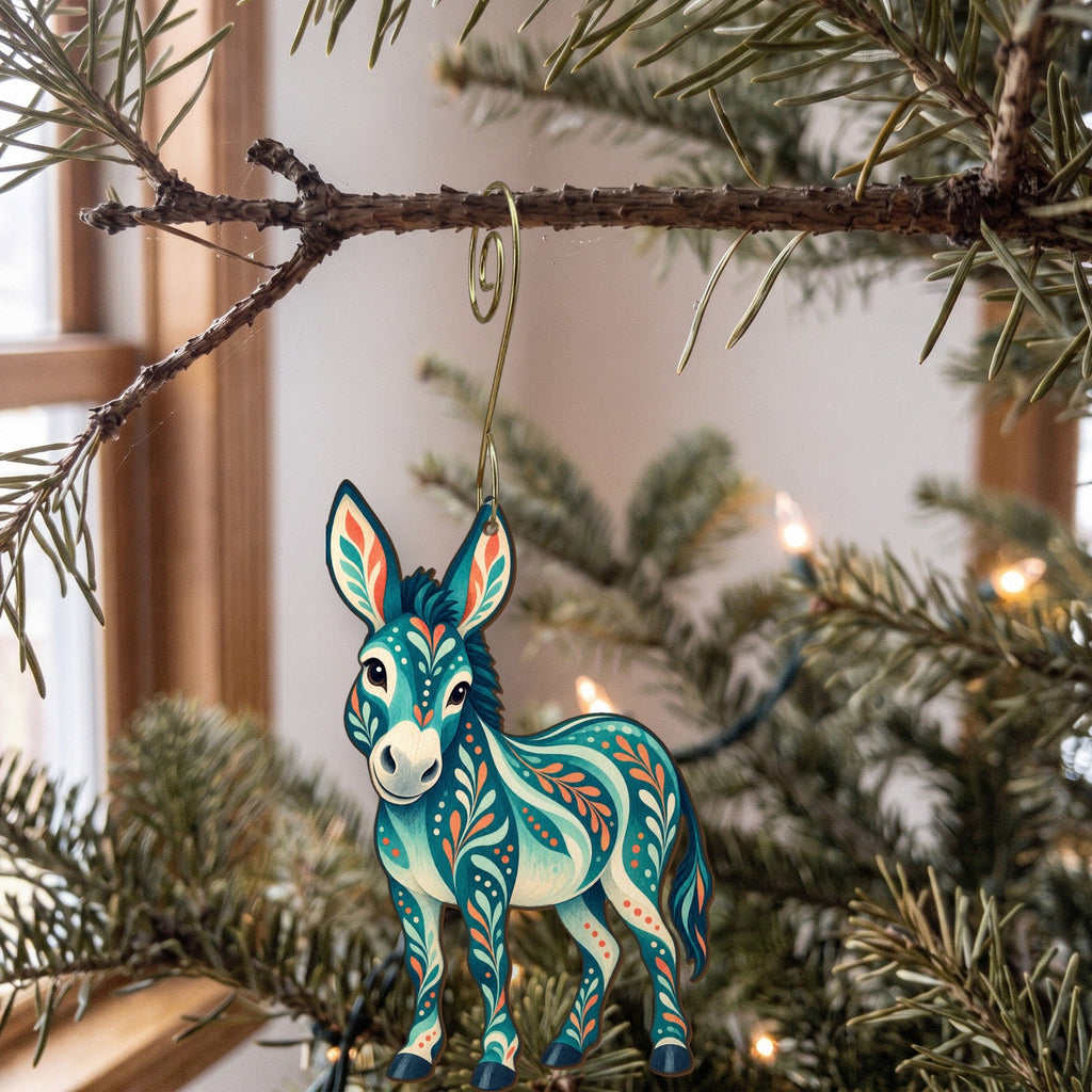 Laser-cut maple wood Donkey folk art ornament O481 hanging on a fir branch, made in USA