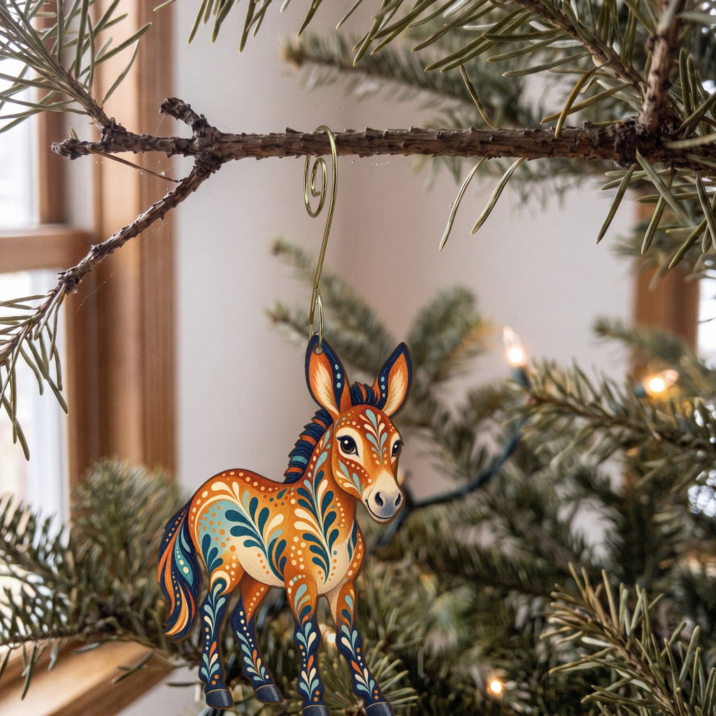 Laser-cut maple wood Miniature Mule folk art ornament O482 hanging on a fir branch, made in USA