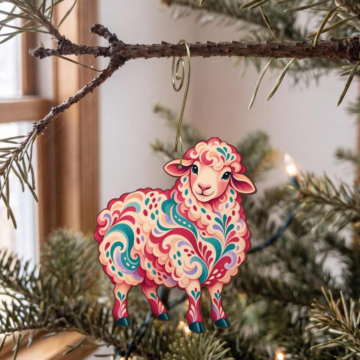 Laser-cut maple wood Merino Sheep folk art ornament O488 hanging on a fir branch, made in USA