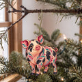 Laser-cut maple wood Gloucestershire Spotted Pig folk art ornament O496 hanging on a fir branch, made in USA