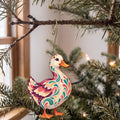Laser-cut maple wood Pekin Duck folk art ornament O500 hanging on a fir branch, made in USA