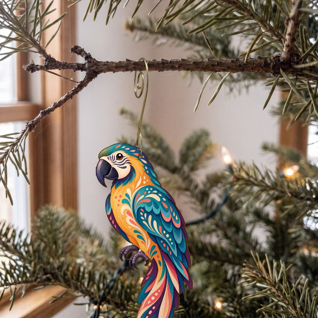 Laser-cut maple wood Blue-And-Gold Macaw folk art ornament O508 hanging on a fir branch, made in USA