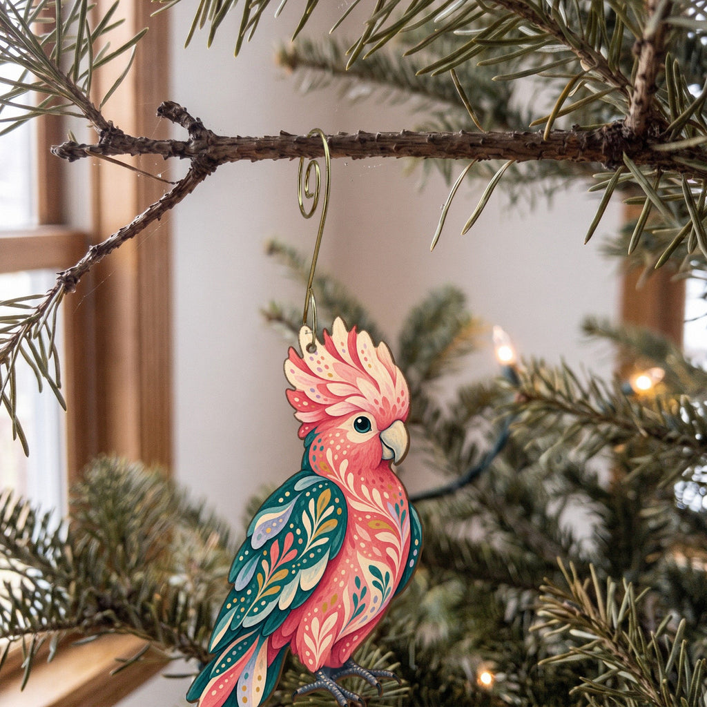 Laser-cut maple wood Galah Cockatoo folk art ornament O511 hanging on a fir branch, made in USA