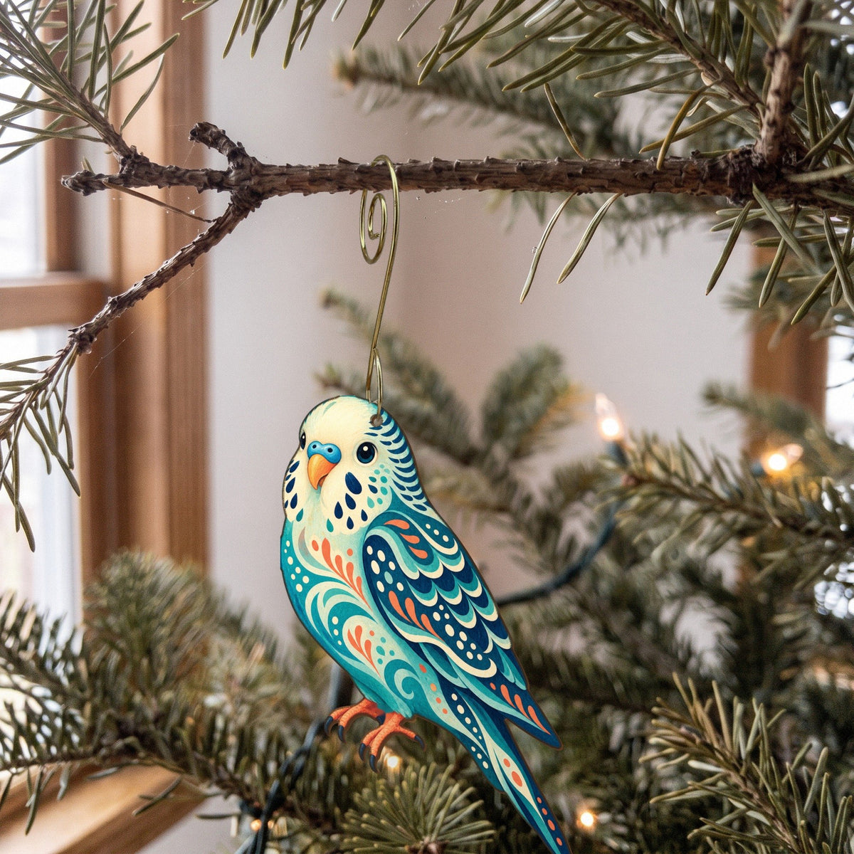 Laser-cut maple wood Budgerigar folk art ornament O513 hanging on a fir branch, made in USA