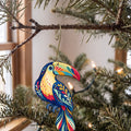 Laser-cut maple wood Keel-Billed Toucan folk art ornament O517 hanging on a fir branch, made in USA