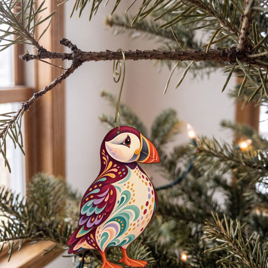 Laser-cut maple wood Atlantic Puffin folk art ornament O518 hanging on a fir branch, made in USA