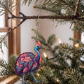 Laser-cut maple wood Southern Cassowary folk art ornament O524 hanging on a fir branch, made in USA
