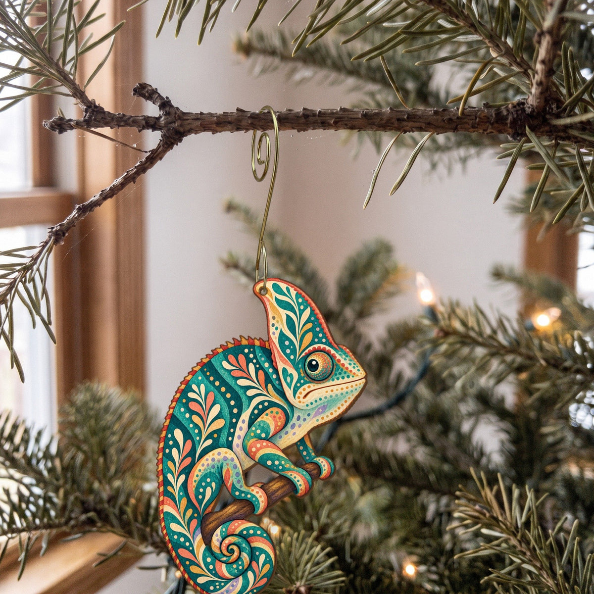 Laser-cut maple wood Veiled Chameleon folk art ornament O527 hanging on a fir branch, made in USA