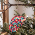 Laser-cut maple wood Panther Chameleon folk art ornament O528 hanging on a fir branch, made in USA