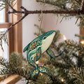 Laser-cut maple wood Blue Whale folk art ornament O99 hanging on a fir branch, made in USA