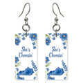 Blue Floral Frame — She's Choosing earrings, shown as a pair