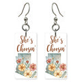 Floral Silhouette — She's Choosing earrings, shown as a pair