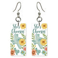 Sunflower Silhouette — She's Choosing earrings, shown as a pair