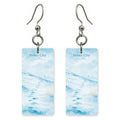 Powder Slopes Text Heber — She's Choosing earrings, shown as a pair