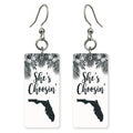 Black Palm Silhouette — She's Choosing earrings, shown as a pair